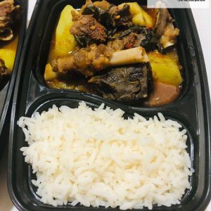 Steamed white rice, served with goat meat pepper soup & sweet potatoes