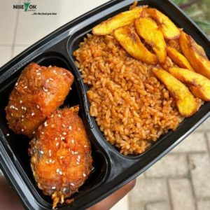 Jollof rice, dodo served with 1 chicken and 1 fish